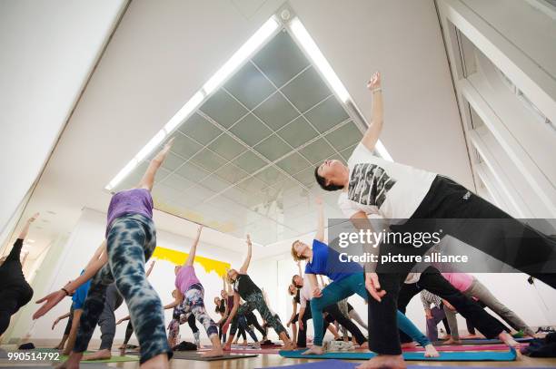 Women practice yoga during a yoga course at the Galery Stadt Sindelfingen in Sindelfingen, Germany, 11 January 2018. In the course of the exhibition...