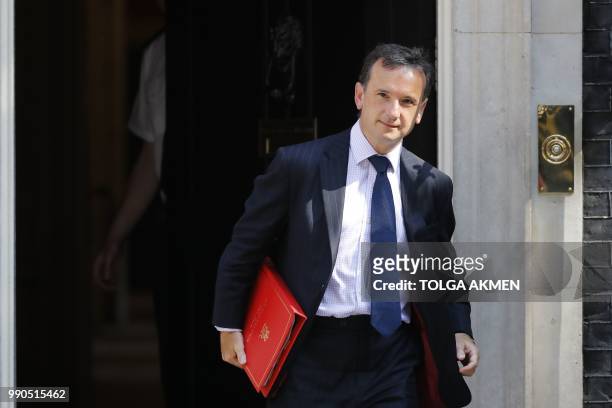Britain's Wales Secretary Alun Cairns leaves 10 Downing Street in central London after attending the weekly cabinet meeting on July 3, 2018.