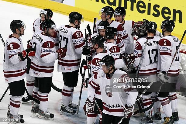 Players of Latvia celebrate after the IIHF World Championship group C match between Italy and Latvia at SAP Arena on May 12, 2010 in Mannheim,...
