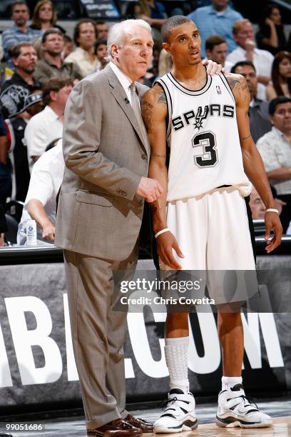 Head coach Gregg Popovich talks to George Hill of the San Antonio Spurs in Game Four of the Western Conference Semifinals against the Phoenix Suns...