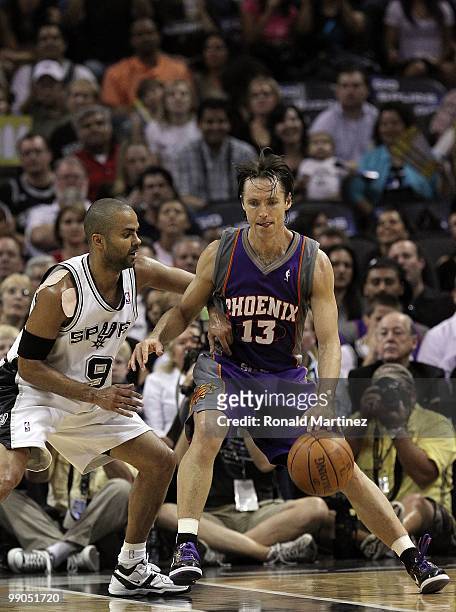 Guard Steve Nash of the Phoenix Suns dribbles the ball past Tony Parker of the San Antonio Spurs in Game Four of the Western Conference Semifinals...