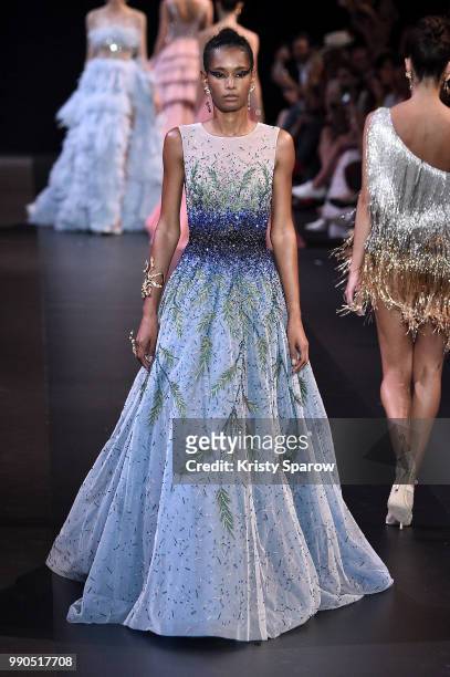 Model Binx Walton walks the runway during the George Hobeika Haute Couture Fall Winter 2018/2019 show as part of Paris Fashion Week on July 2, 2018...
