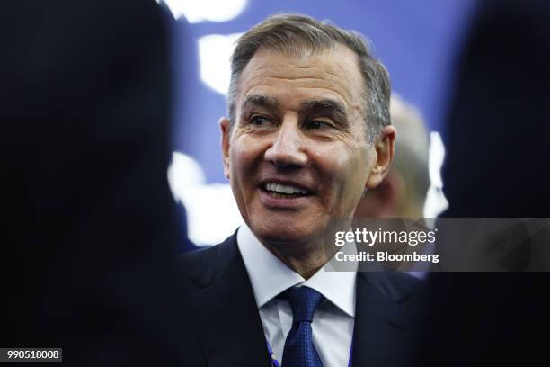 Ivan Glasenberg, billionaire and chief executive officer of Glencore Plc, speaks to fellow attendees during the St. Petersburg International Economic...