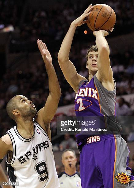 Guard Goran Dragic of the Phoenix Suns takes a shot against Tony Parker of the San Antonio Spurs in Game Four of the Western Conference Semifinals...