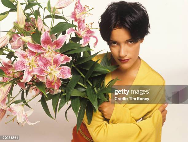 Martika , singer, holding a bunch of flowers, circa 1990.