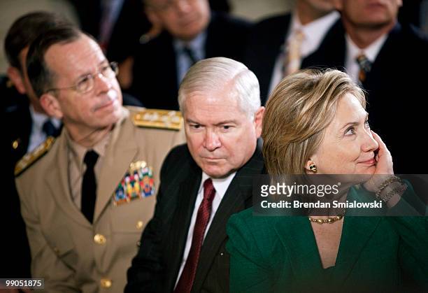 Chairman of the Joint Chiefs Admiral Mike Mullen , Secretary of Defense Robert M. Gates and Secretary of State Hillary Rodham Clinton listen during a...