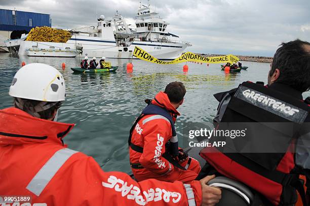 Greenpeace activists on a zodiac block Tuna fishing boats in the harbour of Frontignan, near Montpellier, southern France, on May 12 to ask for a...