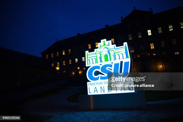 The illuminated sign reads 'CSU Fraktion im bayerischen Landtag' in front of the Banz monastery near Bad Staffelstein, Germany, 15 January 2018. The...