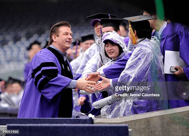 Actor Alec Baldwin greets graduating students at the start of the 2010 New York University Commencement at Yankee Stadium on May 12, 2010 in the...