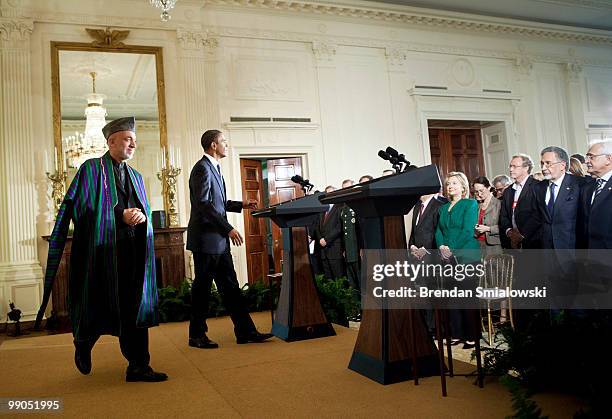 Afghanistan President Hamid Karzai and President Barack Obama arrive for a joint press conference in the East Room of the White House May 12, 2010 in...