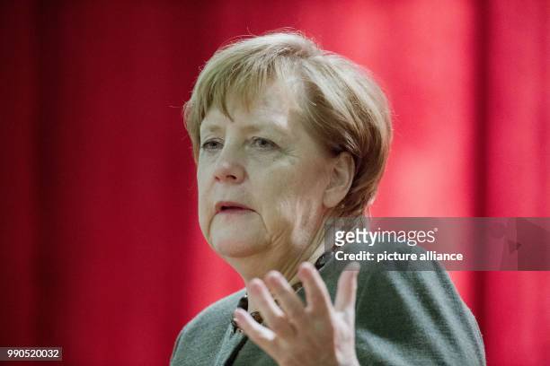 German Chancellor Angela Merkel delivers a speech during the New Year's Reception of the state counsil of the district Vorpommern-Ruegen in...