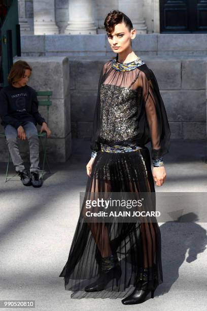 Model presents a creation by Chanel during the 2018-2019 Fall/Winter Haute Couture collection fashion show at the Grand Palais in Paris, on July 3,...