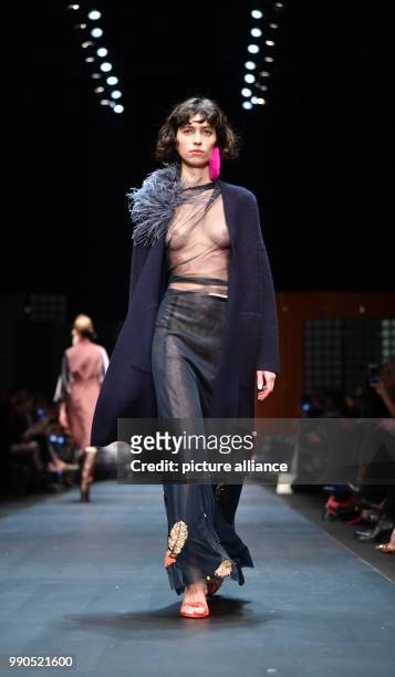 Model walks the runway during the show of Dawid Tomaszewski at the E-Werk during the Berlin Fashion Week in Berlin, Germany, 15 January 2018. In the...