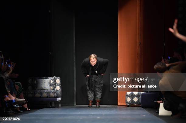 Designer Dawid Tomaszewski takes a bow at the show of Dawid Tomaszewski at the E-Werk during the Berlin Fashion Week in Berlin, Germany, 15 January...