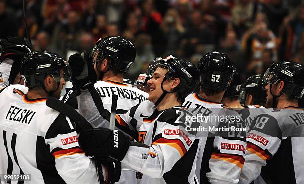 Alexander Barta of Germany celebrate with his team mates after the IIHF World Championship group A match between Denmark and Germany at Lanxess Arena...