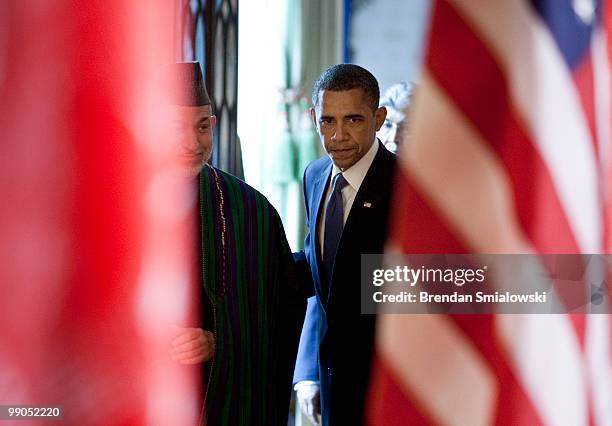 Afghanistan President Hamid Karzai and President Barack Obama arrive for a joint press conference in the East Room of the White House May 12, 2010 in...