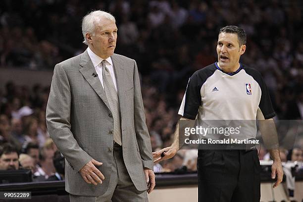 Head coach Gregg Popovich of the San Antonio Spurs and referee, Monty McCutchen in Game Four of the Western Conference Semifinals during the 2010 NBA...