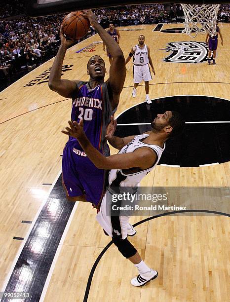 Forward Dwayne Jones of the Phoenix Suns takes a shot against Tim Duncan of the San Antonio Spurs in Game Four of the Western Conference Semifinals...
