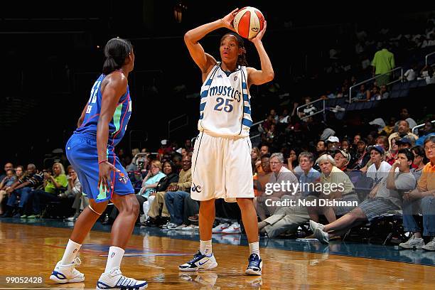 Monique Currie of the Washington Mystics looks to pass over Kalana Greene of the New York Liberty during the WNBA preseason game on May 5, 2010 at...