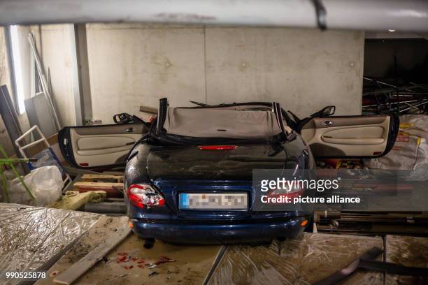 Car pictured lying on a parking deck in a car park in Wiesbaden, Germany, 15 January 2018. The Fire Department stated early Tuesday morning that the...