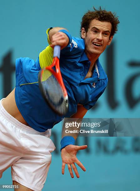 Andy Murray of Great Britain serves against Juan Ignacio Chela of Argentina in their second round match during the Mutua Madrilena Madrid Open tennis...