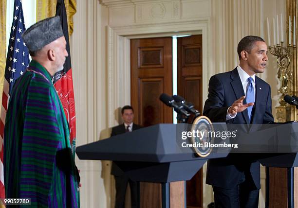 Hamid Karzai, Afghanistan's president, left, and U.S. President Barack Obama hold a joint news conference in the East Room of the White House in...