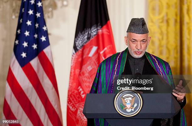 Hamid Karzai, Afghanistan's president, speaks during a joint news conference with U.S. President Barack Obama in the East Room of the White House in...