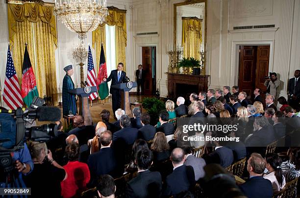 Hamid Karzai, Afghanistan's president, left, and U.S. President Barack Obama hold a joint news conference in the East Room of the White House in...