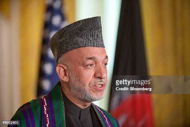 Hamid Karzai, Afghanistan's president, speaks during a joint news conference with U.S. President Barack Obama in the East Room of the White House in...