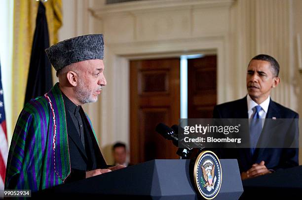Hamid Karzai, Afghanistan's president, left, and U.S. President Barack Obama hold a joint news conference in the East Room of the White House in...