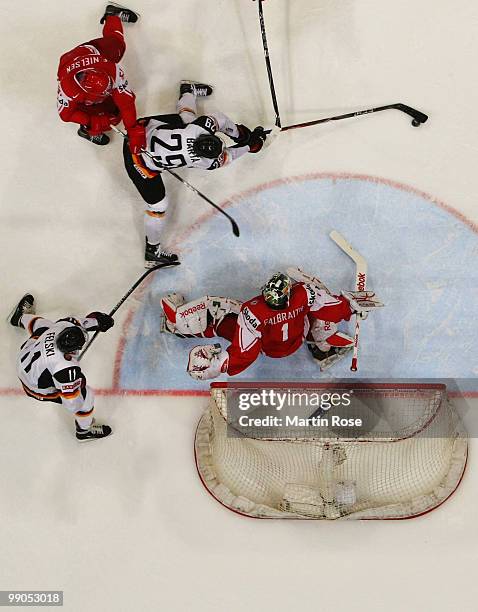 Alexander Barta of Germany tries to score over Patrick Galbraith, goalkeeper of Denmark during the IIHF World Championship group A match between...