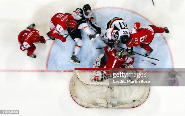 Marcel Goc of Germany scores his team's 4th goal over patrick Galbraith, goalkeeper of Denmark during the IIHF World Championship group A match...