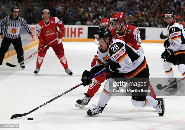 Lars Eller of Denmark and Alexander Barta of Germany battle for the puck during the IIHF World Championship group A match between Denmark and Germany...