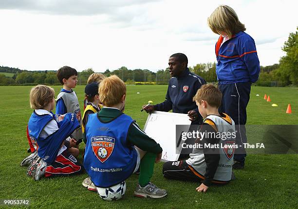 Children are coached during the UEFA Grassroots Football Day at Saffron Walden County High School on May 12, 2010 in Saffron Walden, England.