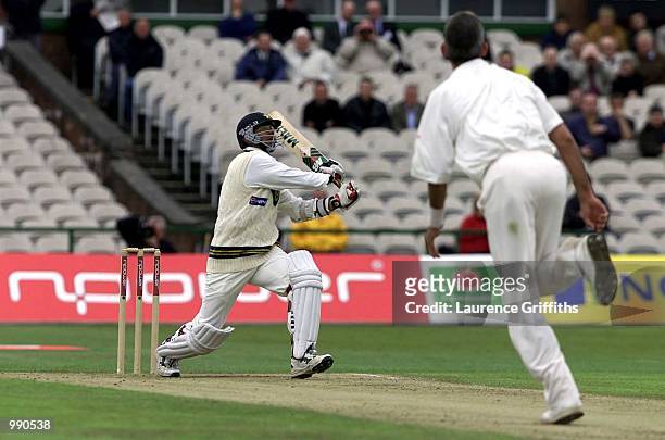 Saqlain Mushtaq of Pakistan hits Andrew Caddick of England for six during the Second Npower Test match between England and Pakistan at Old Trafford,...