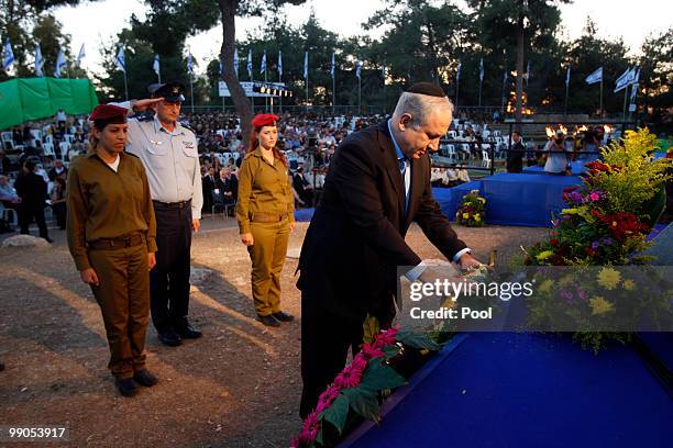 Israeli Prime Minister Benjamin Netanyahu lays a wreath during a ceremony marking Jerusalem Day at Ammunition Hill on May 12, 2010 in Jerusalem,...