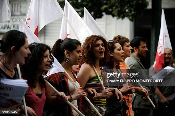 Demonstrators shout slogans while marching in central Athens on May 12, 2010. Greece was to receive a first dose of 5.5 billion euros from the IMF...