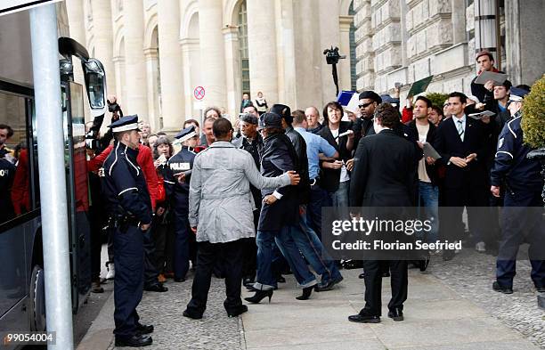 Singer Whitney Houston and crew member leave the hotel de Rome on May 12, 2010 in Berlin, Germany.