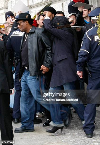 Singer Whitney Houston and crew member leave the hotel de Rome on May 12, 2010 in Berlin, Germany.