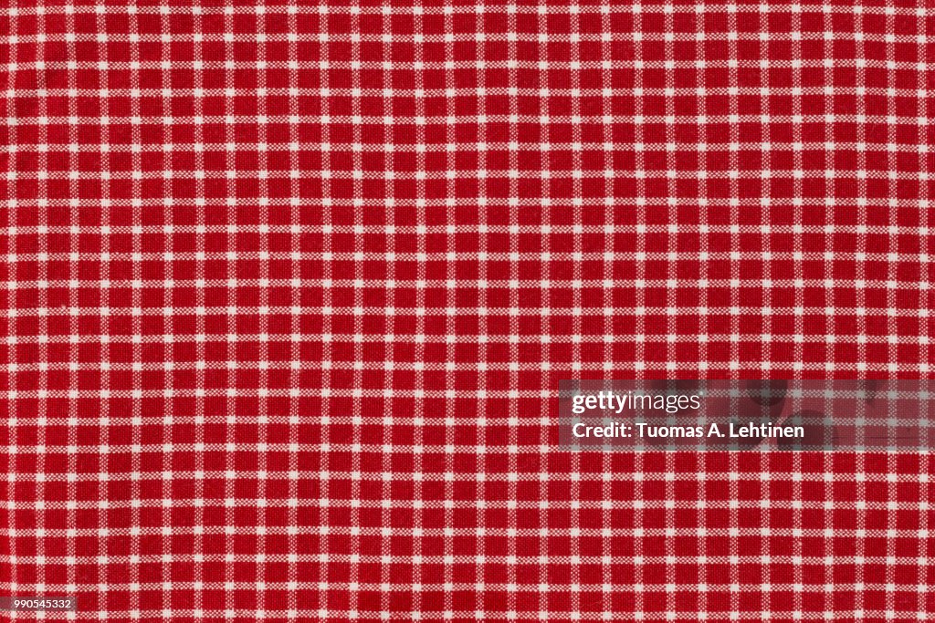 Checkered picnic gingham tablecloth, with red and white squares. Useful as background or backdrop for food editing.