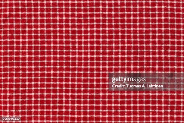 checkered picnic gingham tablecloth, with red and white squares. useful as background or backdrop for food editing. - red plaid stock pictures, royalty-free photos & images