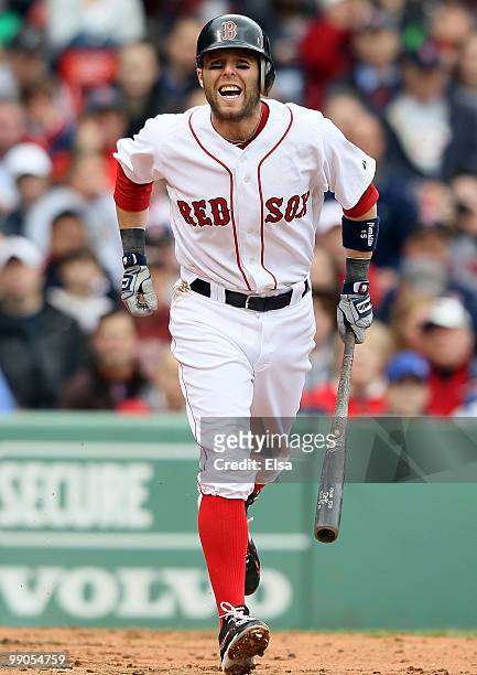 Dustin Pedroia of the Boston Red Sox heads to first base after getting hit by a pitch in the third inning against the Toronto Blue Jays on May 12,...