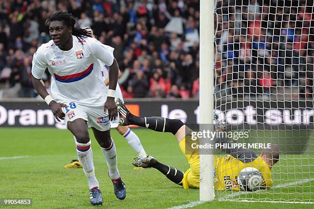 Lyon's French forward Bafetimbi Gomis celebrates after scoring a goal during the French L1 football match Lyon versus Monaco on May 12, 2010 at the...