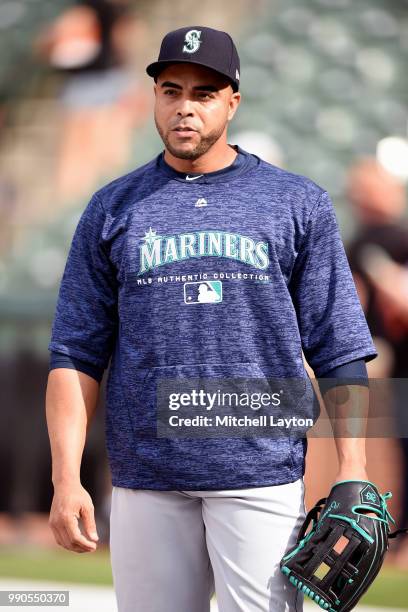 Nelson Cruz of the Seattle Mariners looks on during batting practice of a baseball game against the Baltimore Orioles at Oriole Park at Camden Yards...