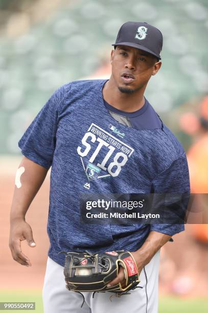 Jean Segura of the Seattle Mariners warms up during batting practice of a baseball game against the Baltimore Orioles at Oriole Park at Camden Yards...