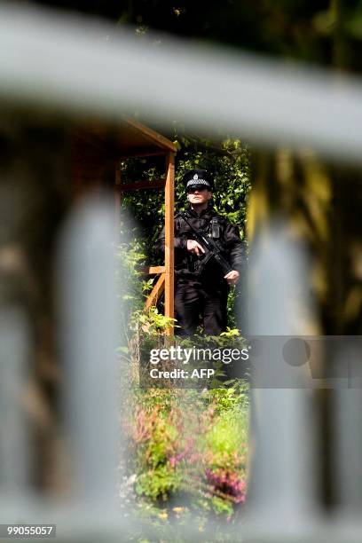 Police stand guard outside the residence of Britain's former Prime Minister Gordon Brown in North Queensferry. Former foreign secretary David...