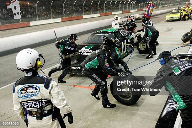 Brian Scott, driver of the AccuDoc Solutions Toyota, pits during the NASCAR Nationwide series Royal Purple 200 presented by O'Reilly Auto Parts at...