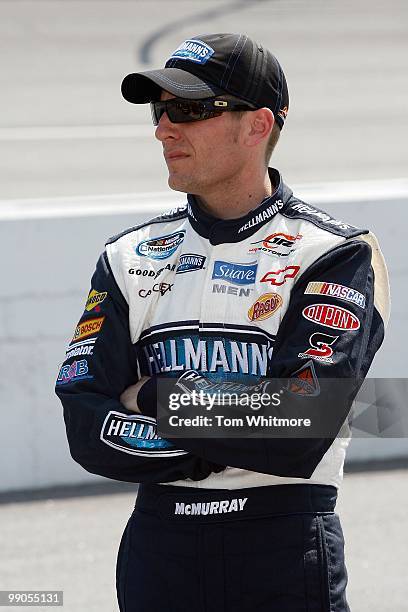 Jamie McMurray, driver of the Hellmann's Chevrolet, stands on the grid during qualifying for the NASCAR Nationwide series Royal Purple 200 presented...