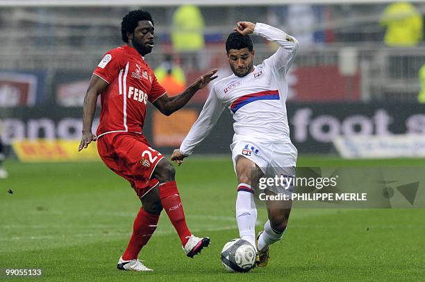 Monaco's Nigerian Midfielder Lukman Haruna vies with Lyon's Brazilian middfielder Honorato Campos Ederson during the French L1 football match Lyon...