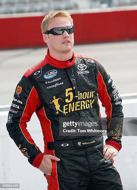 Steve Wallace, driver of the 5-hour Energy Toyota, looks on during qualifying for the NASCAR Nationwide series Royal Purple 200 presented by O'Reilly...